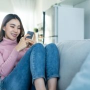 asian-beautiful-woman-sit-on-sofa-and-chat-on-mobi-2021-12-09-20-22-54-utc
